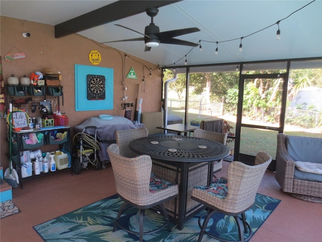 sunroom / solarium with ceiling fan and beamed ceiling