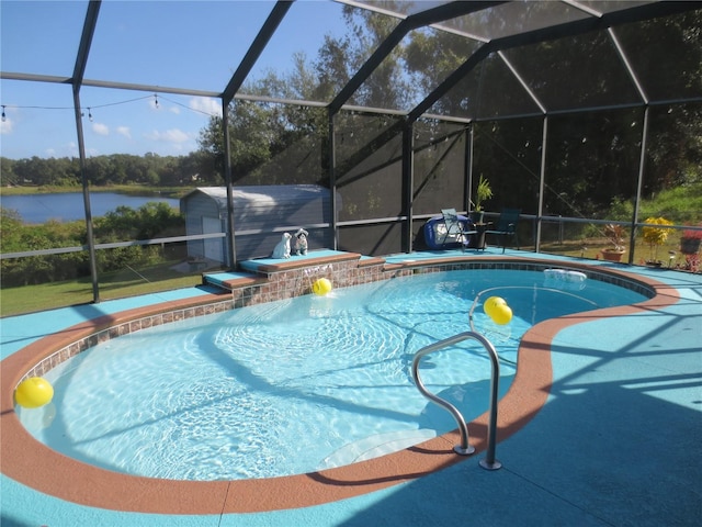 view of pool featuring pool water feature and glass enclosure