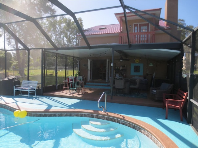 view of pool featuring a patio area and glass enclosure