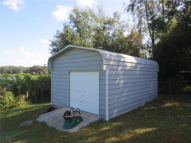 garage with a lawn