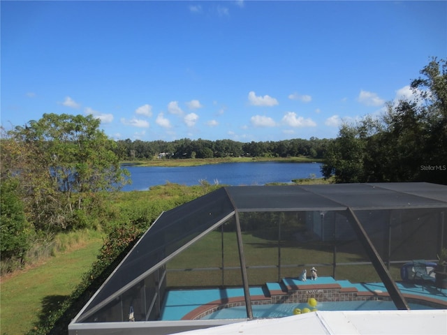 view of pool featuring a patio area, a water view, and a lanai