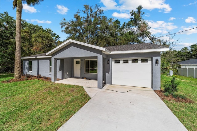 ranch-style home with a front yard and a garage