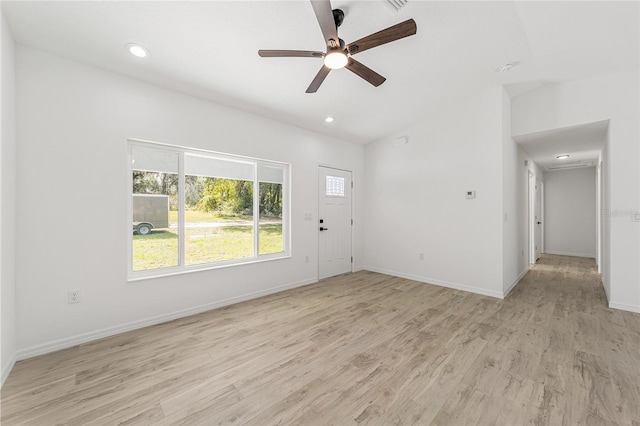 interior space featuring vaulted ceiling, light wood-type flooring, and ceiling fan