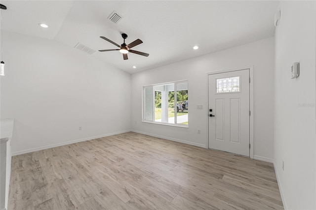 foyer entrance featuring vaulted ceiling, light hardwood / wood-style floors, and ceiling fan