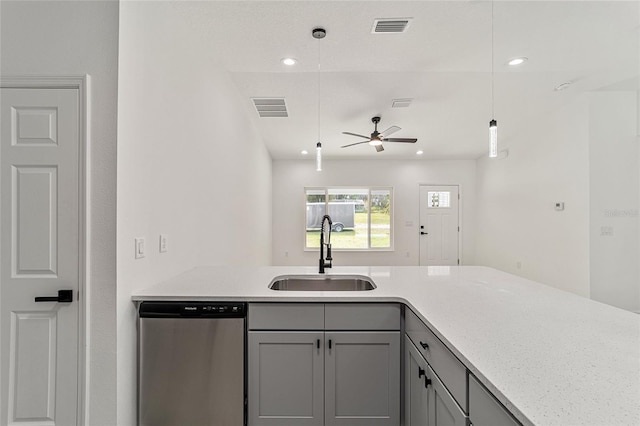 kitchen featuring ceiling fan, stainless steel dishwasher, sink, gray cabinetry, and decorative light fixtures