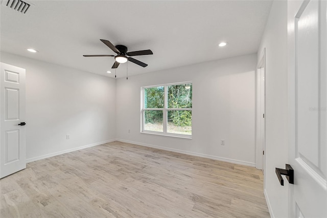 empty room featuring light hardwood / wood-style floors and ceiling fan