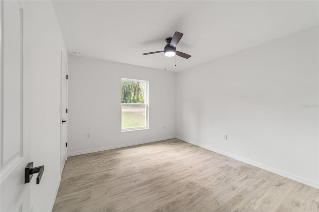 empty room featuring light hardwood / wood-style floors and ceiling fan