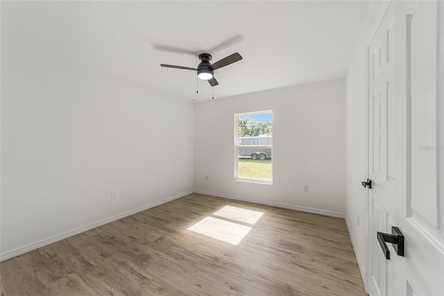 unfurnished room featuring light wood-type flooring and ceiling fan