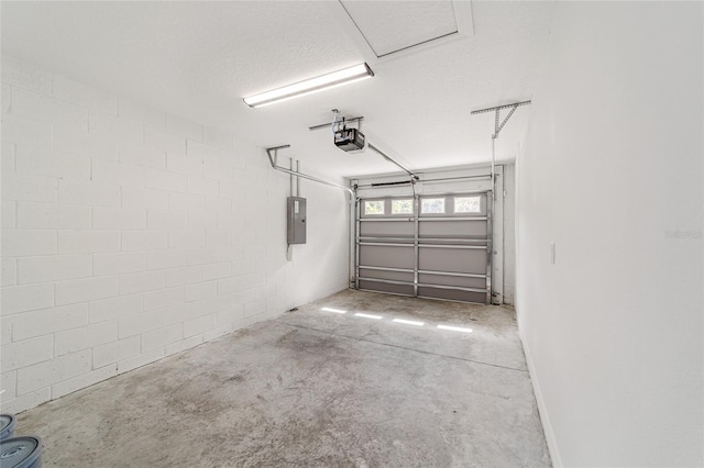 garage featuring a garage door opener and electric panel