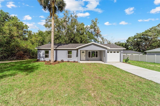 ranch-style home featuring a front lawn and a garage