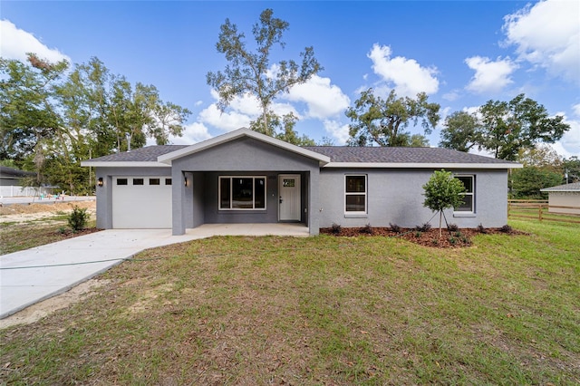 ranch-style home with a front lawn and a garage