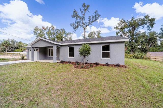 ranch-style house with a front lawn