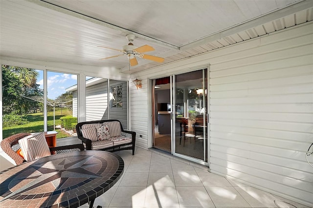 sunroom / solarium with ceiling fan