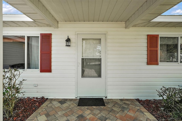 doorway to property with a patio area