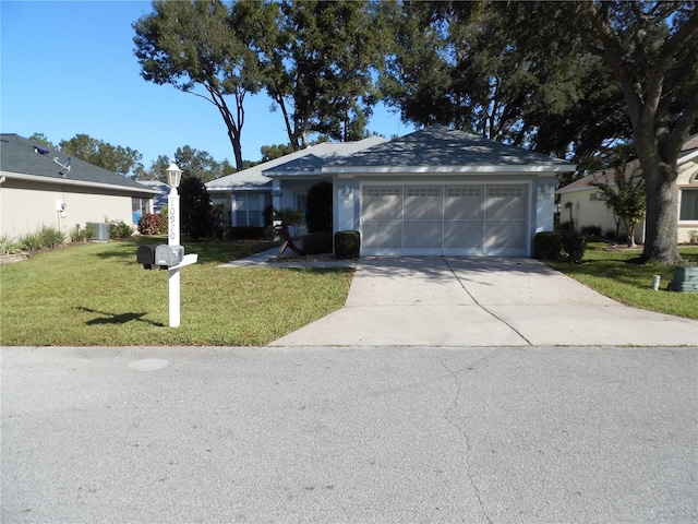 ranch-style home with a front lawn and a garage