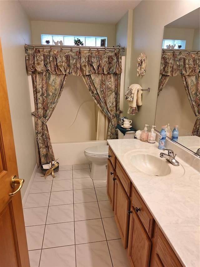 full bathroom featuring toilet, shower / bath combo, vanity, and tile patterned flooring