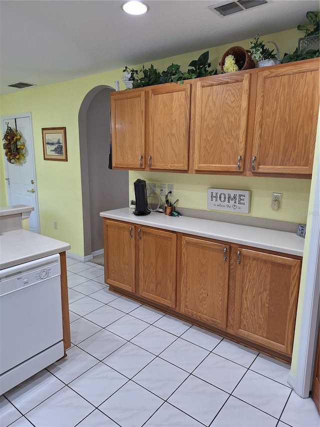 kitchen with white dishwasher and light tile patterned floors