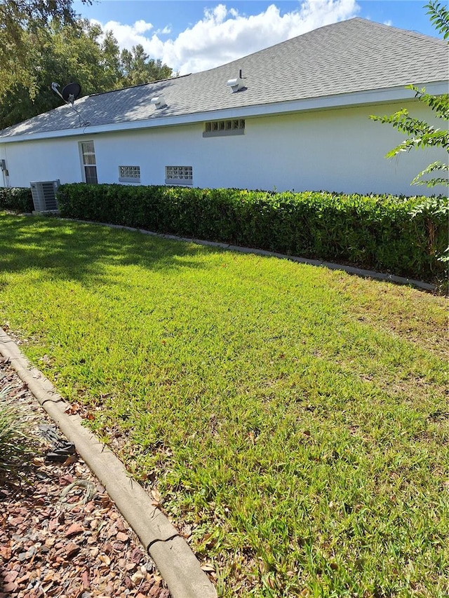 view of yard with central AC