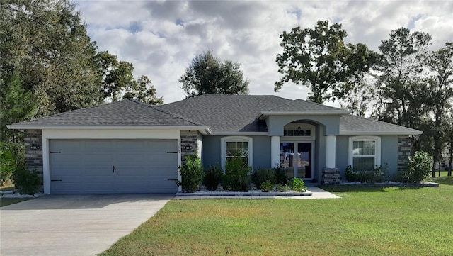 ranch-style house with a garage and a front lawn