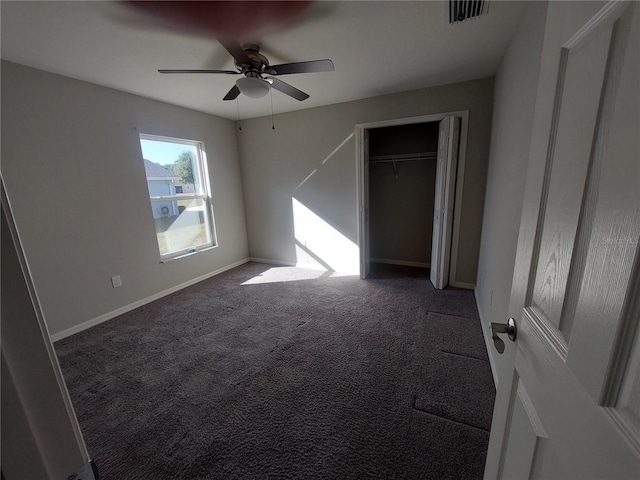 unfurnished bedroom with carpet, ceiling fan, and a closet