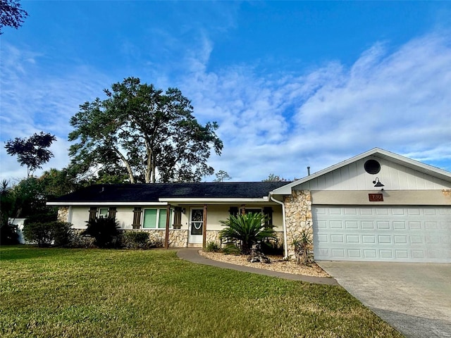 ranch-style home with a front lawn and a garage