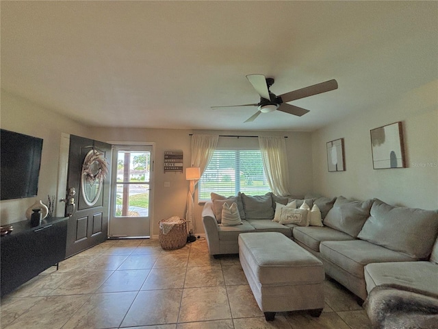 tiled living room featuring ceiling fan