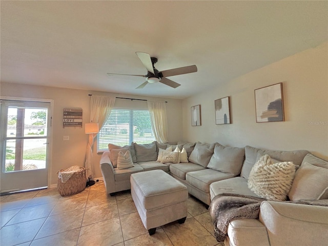 tiled living room with ceiling fan