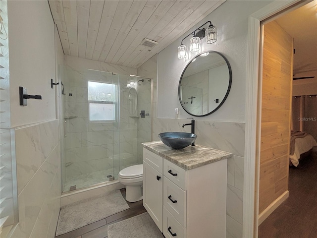 bathroom featuring walk in shower, toilet, wood ceiling, tile walls, and vanity