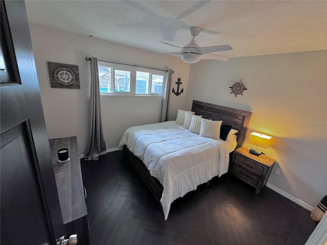 bedroom featuring dark parquet flooring and ceiling fan