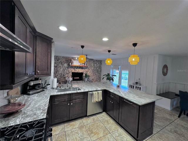 730 NE 18th Ave, Ocala, FL 34470 - kitchen with a sink, a peninsula, decorative light fixtures, dishwasher, and light stone countertops