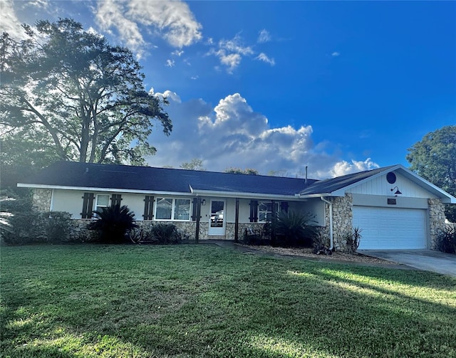 single story home featuring a front yard and a garage