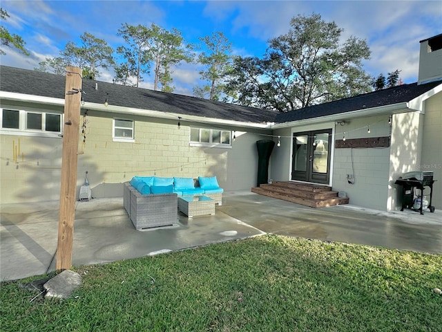 exterior space featuring an outdoor living space, a yard, and a patio