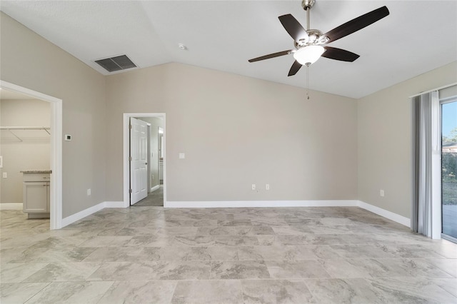 spare room with vaulted ceiling and ceiling fan