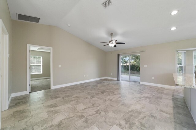 empty room featuring vaulted ceiling and ceiling fan