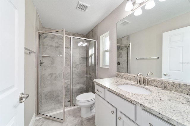 bathroom featuring vanity, toilet, walk in shower, and a textured ceiling