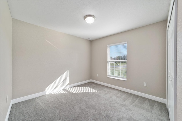 unfurnished room with carpet floors