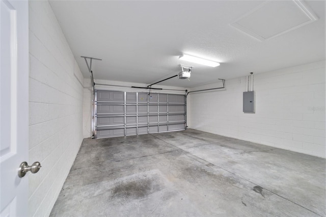 garage featuring a garage door opener and electric panel