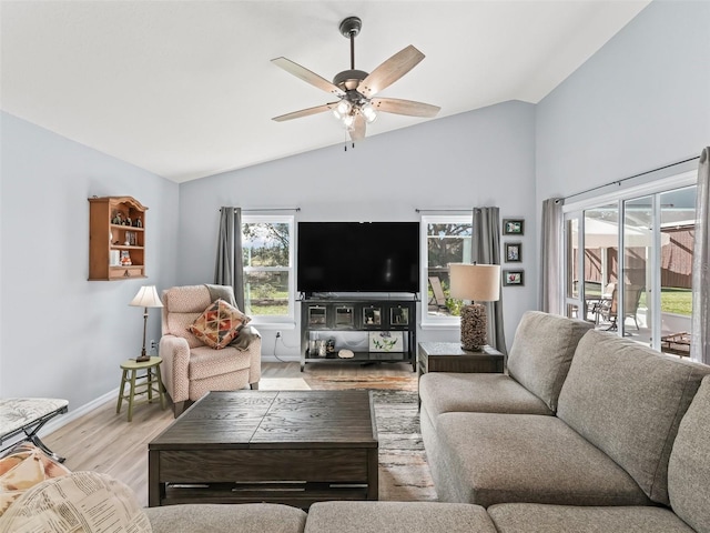 living room featuring light hardwood / wood-style floors, plenty of natural light, lofted ceiling, and ceiling fan