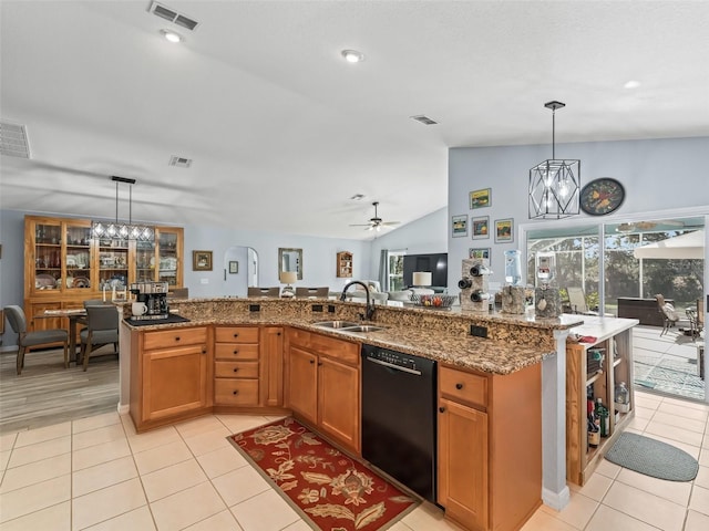 kitchen with pendant lighting, black dishwasher, lofted ceiling, and sink