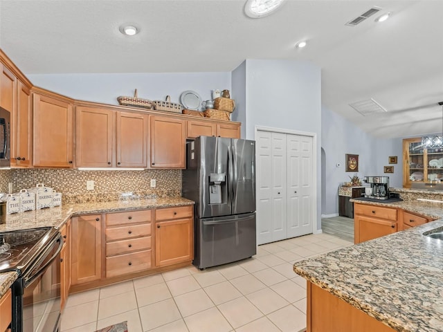 kitchen featuring electric range, tasteful backsplash, stainless steel fridge with ice dispenser, lofted ceiling, and light tile patterned flooring