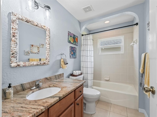 full bathroom with vanity, toilet, shower / bath combo, and tile patterned floors