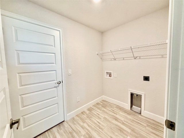 laundry room featuring light wood finished floors, hookup for a washing machine, hookup for an electric dryer, laundry area, and baseboards