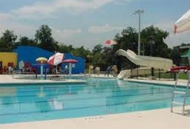 view of swimming pool featuring a water slide