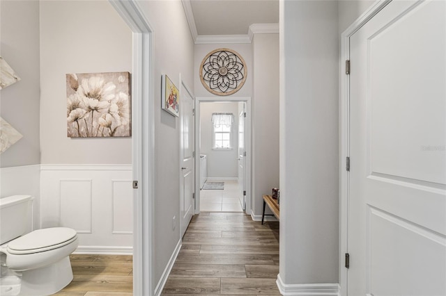 interior space with hardwood / wood-style floors and crown molding