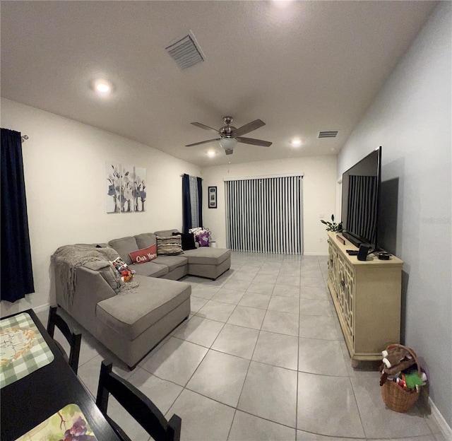 tiled living room with ceiling fan