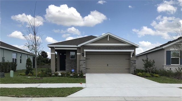 view of front of home featuring a garage and a front yard