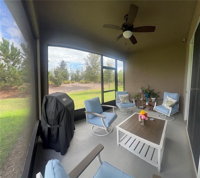 sunroom / solarium with ceiling fan