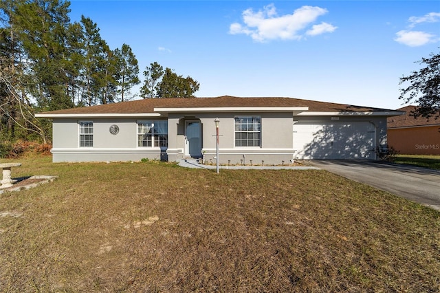 ranch-style home featuring a front lawn and a garage