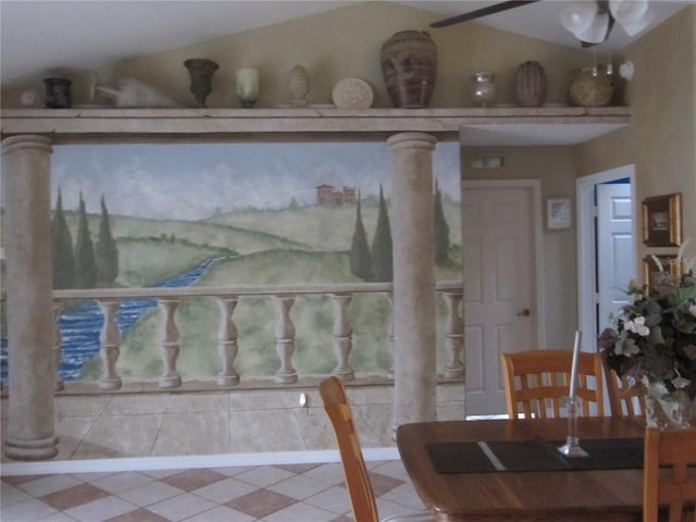 dining room with vaulted ceiling and tile patterned flooring