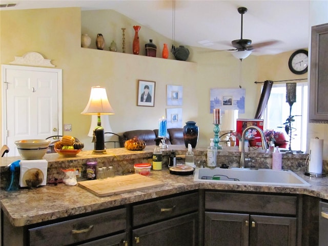 kitchen featuring dark brown cabinetry, sink, and ceiling fan